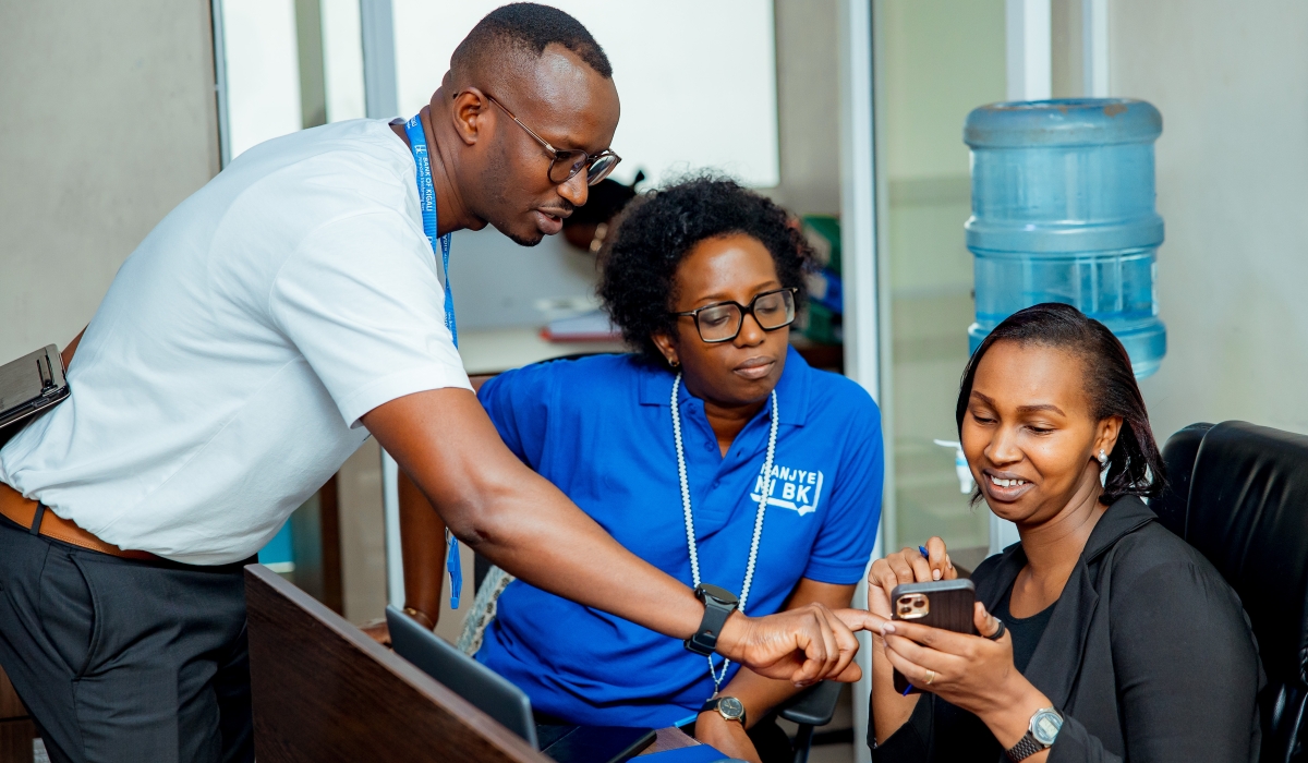 BK CEO Dianne Karusisi and a staff member during the ‘Nanjye ni BK’ campaign that aims to achieve financial inclusion and ease banking services for its clients. Courtesy photos