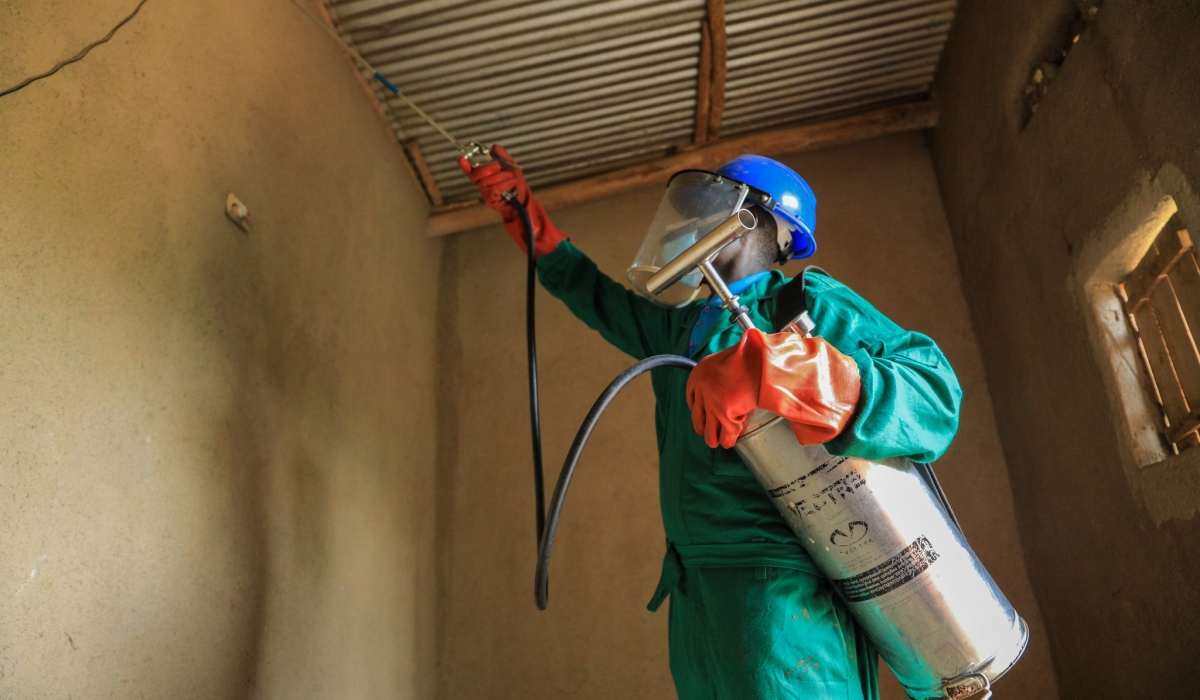 A health worker during indoor residual spraying exercise in Bugesera. Photo by Craish Bahizi