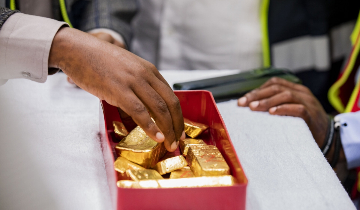 A worker showcases processed gold at Gasabo Gold Refinery (GGR) in Kigali on December 1, 2023. According to RMA, reducing taxes on minerals, including gold, could attract investors to the country, and stimulate interest in selling processed minerals. Photo by Emmanuel Dushimimana