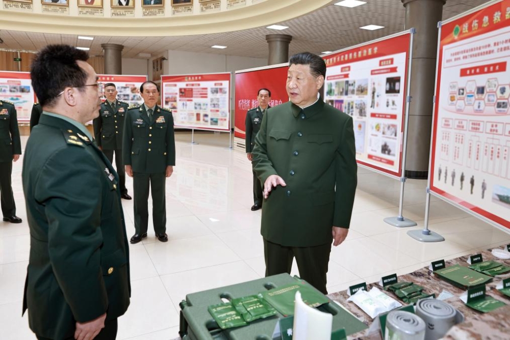 Chinese President Xi Jinping, also general secretary of the Communist Party of China Central Committee and chairman of the Central Military Commission, learns about the equipment concerning battlefield medical treatment and its operation demonstration at the Army Medical University on April 23, 2024. Xi inspected the Army Medical University on Tuesday. (Xinhua/Li Gang)