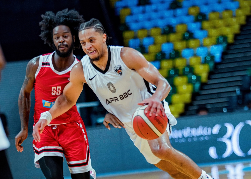 APR Basketball Club new point guard Obadiah Noel dribbles past REG BB player during Genocide Memorial Tournament at BK Arena. Dan Gatsinzi