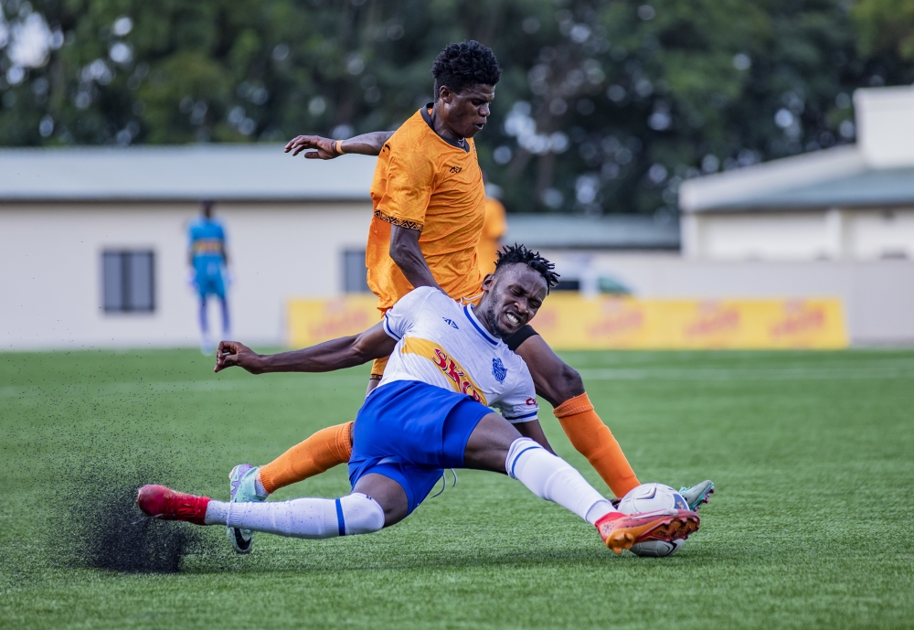 Rayon Sports winger Arsene Tuyisenge vies for the ball against Bugesera FC attacking midfielder Faruk Ruhinda during a 0-1 match at Kigali Pele stadium. Photo by Emmanuel Dushimimana
