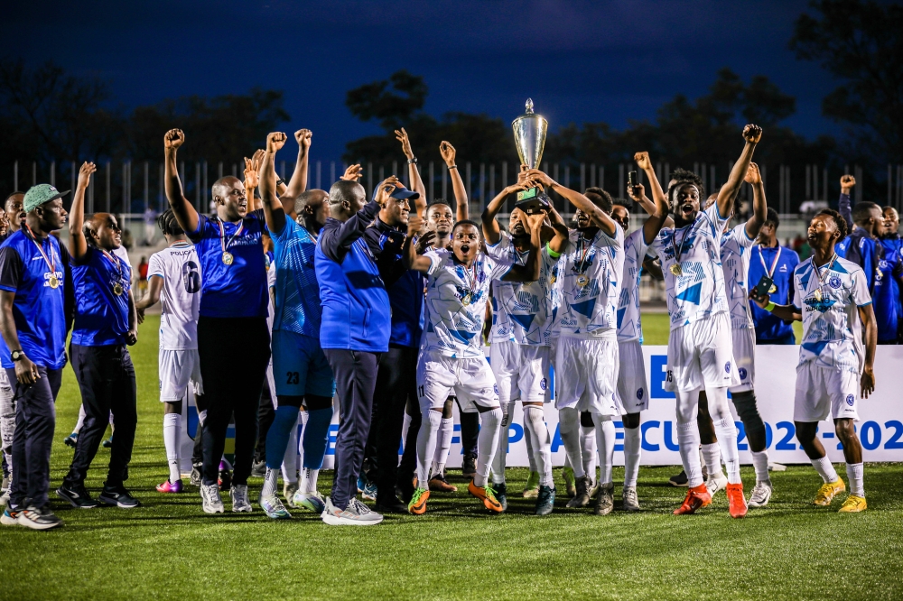Police FC players and staff celebrate the 2024 Peace Cup trophy, their first since 2015.  The law enforcers won the title after beating Bugesera FC 2-1 in the final held at Kigali Pele Stadium on Wednesday, May 1. All photo by Craish Bahizi