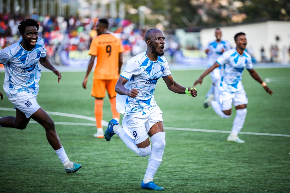 Police FC midfielder Eric Nsabimana and teammates while celebrating the second goal that enabled the Law enforcers' side to win 2024 Peace Cup title