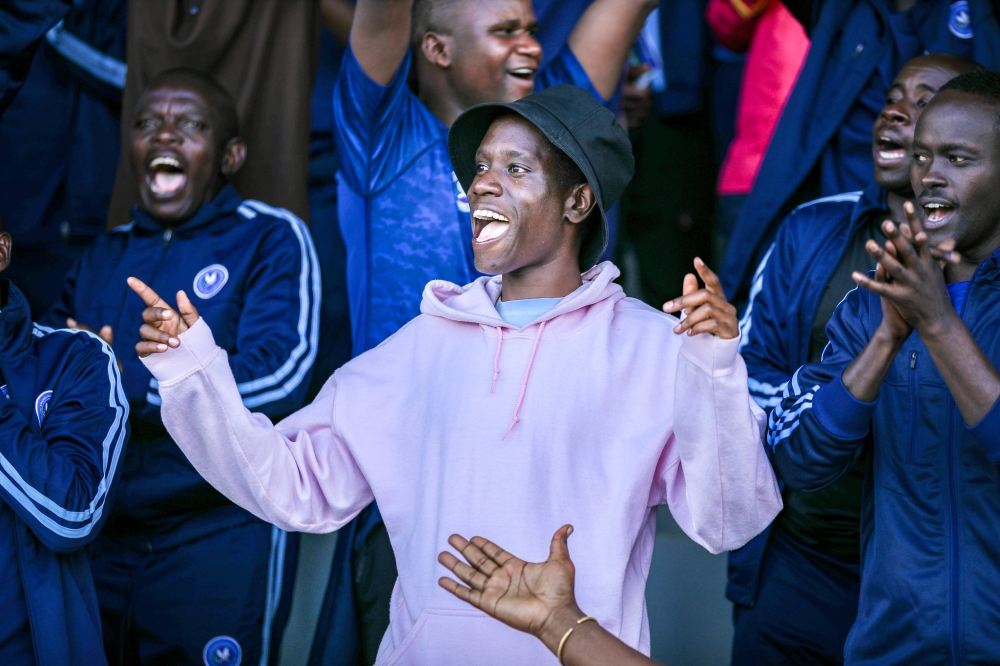 Police FC fans celebrate the 2024 Peace Cup trophy, their first since 2015.  The law enforcers won the title after beating Bugesera FC 2-1 in the final held at Kigali Pele Stadium on Wednesday, May 1. All photo by Craish Bahizi