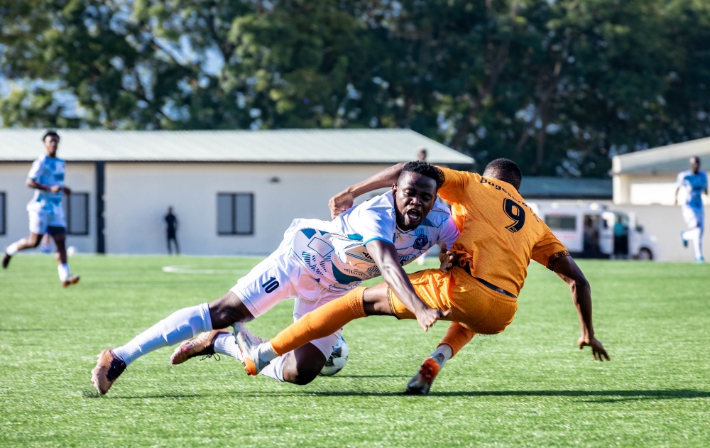 Midfielder Muhadjili Hakizimana vies for the ball with Bugesera Fc&#039;s player at Kigali Pele stadium