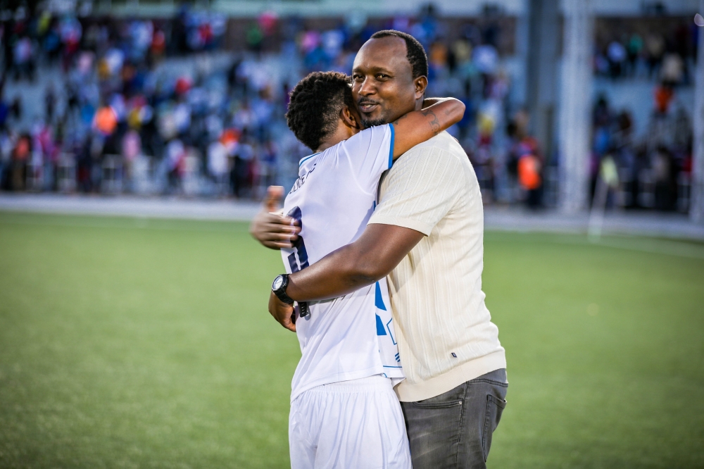 Vincent Mashami, Police FC head coach and his striker Savio Nshuti celebrate the crucial win after beating Bugesera FC 2-1 to win the 2024 Peace Cup title at Kigali Pele Stadium on May, 1. Photo by Craish Bahizi