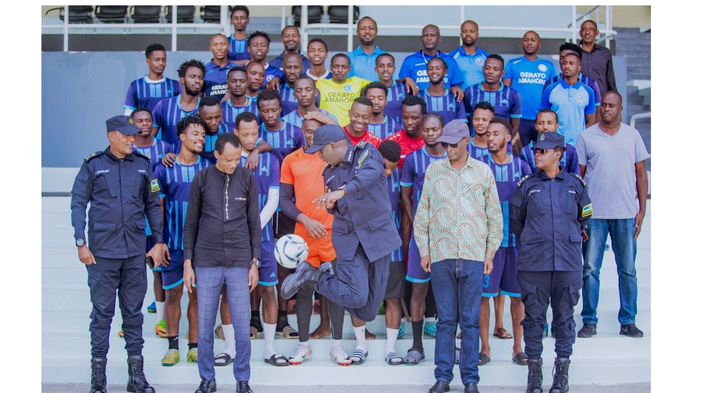 Inspector General of Police Félix Namuhoranye(C) with Police FC players and staff pose for a group photo. IGP Namuhoranye revealed that the club is ready to stick with head coach Vincent Mashami next season. Courtesy
