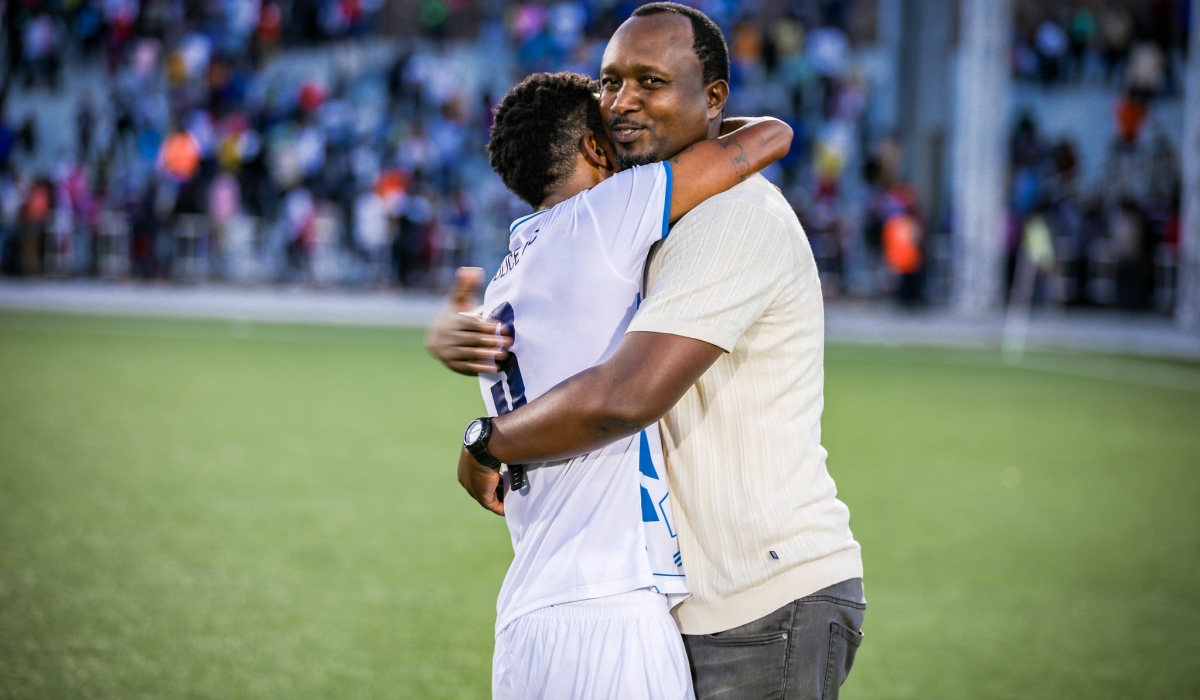 Vincent Mashami, Police FC head coach and his striker Savio Nshuti celebrate the crucial win after beating Bugesera FC 2-1 to win the 2024 Peace Cup title at Kigali Pele Stadium on May, 1. Photo by Craish Bahizi