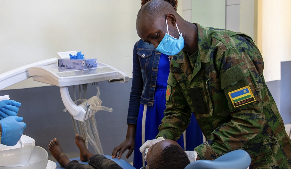 A Rwanda Defence Force medical officer attends to a patient during a past medical outreach exercise in Rwamagana District. Courtesy