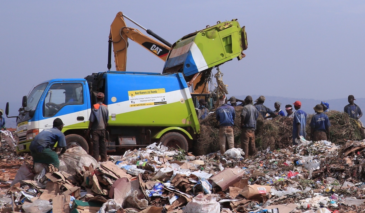 Workers sorting waste at Nduba landfill in Nduba Sector, Gasabo District. File