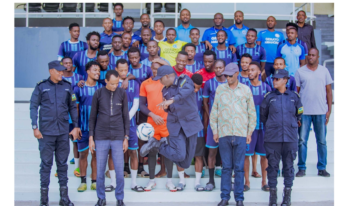 Inspector General of Police Félix Namuhoranye(C) with Police FC players and staff pose for a group photo. IGP Namuhoranye revealed that the club is ready to stick with head coach Vincent Mashami next season. Courtesy