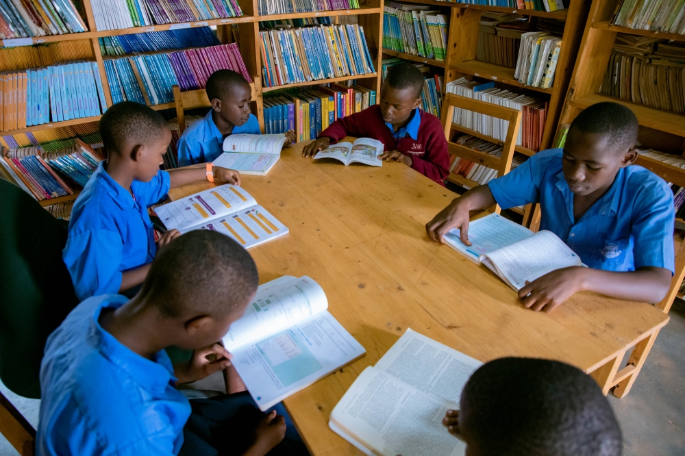 Students reading books in the Library at Groupe Scolaire Kimisange in Kigali. Photo by Dan Gatsinzi