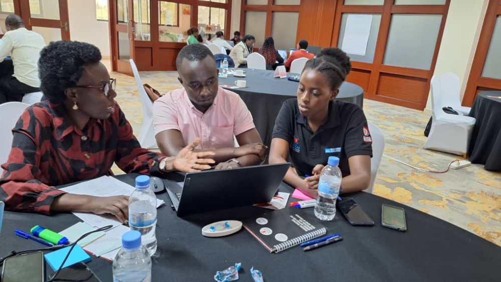 Members of the group that is translating that toolkit on sexual and reproductive health to address teen pregnancies,  from English into Kinyarwanda. File