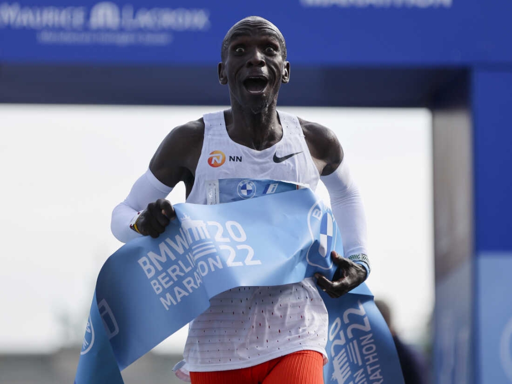 Kenya&#039;s Eliud Kipchoge crosses the line to win the Berlin Marathon in Berlin, Germany, Sunday, Sept. 25, 2022. Olympic champion Eliud Kipchoge has bettered his own world record in the Berlin Marathon. Kipchoge clocked 2:01:09 on Sunday to shave 30 seconds off his previous best-mark of 2:01:39 from the same course in 2018. (AP Photo/Christoph Soeder)