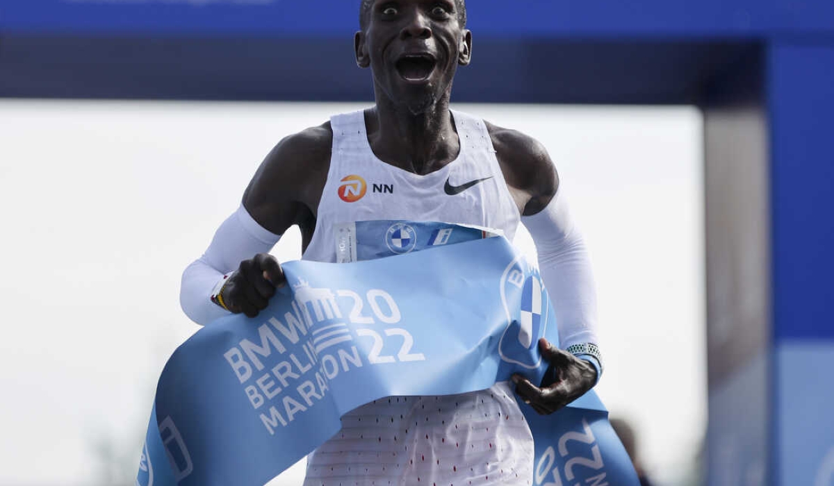 Kenya&#039;s Eliud Kipchoge crosses the line to win the Berlin Marathon in Berlin, Germany, Sunday, Sept. 25, 2022. Olympic champion Eliud Kipchoge has bettered his own world record in the Berlin Marathon. Kipchoge clocked 2:01:09 on Sunday to shave 30 seconds off his previous best-mark of 2:01:39 from the same course in 2018. (AP Photo/Christoph Soeder)