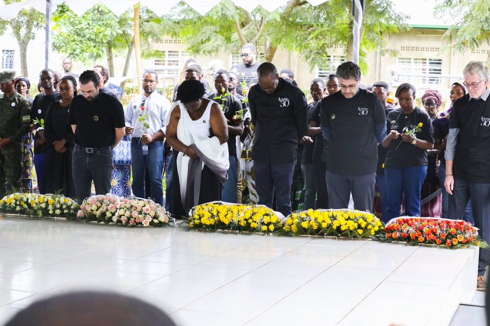 Staff and Management of five companies involved in the construction of the Bugesera airport observe a moment of silence to pay tribute to the victims at the Gashora Genocide Memorial on May 8. Photos by Craish Bahizi