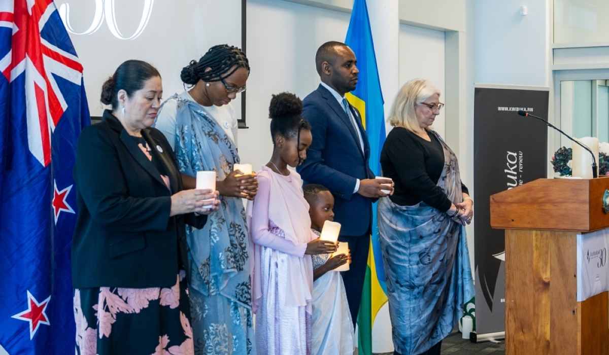 Rwanda’s High Commissioner to New Zealand, Jean de Dieu Uwihanganye ( 2nd R) with other mourners, observe a moment of silence in honour of the victims during the commemoration event in Auckland, New Zealand on April 20,2024. Courtesy