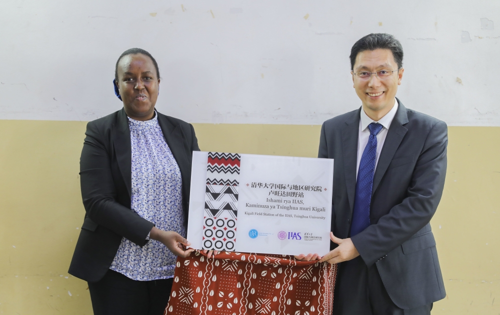 UR&#039;s Deputy Vice Chancellor for Finance, Francoise Tengera and Zhao Jinsong, Associate Director, IIAS, Tsinghua University, showcase the partners during the  launch of a field station for international and area studies at the University of Rwanda (UR) in Kigali on Thursday, May 9. All photos by Craish Bahizi