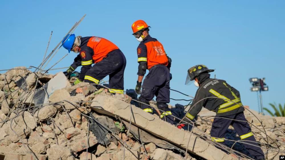 Rescue personnel search the site of a building collapse in George, South Africa, May 9, 2024. Internet