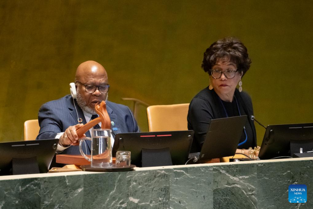 UN General Assembly President Dennis Francis (L) strikes his gavel to signal the adoption of a resolution during the 10th Emergency Special Session of the General Assembly at the UN headquarters in New York, on May 10, 2024. The UN General Assembly (UNGA) on Friday adopted a resolution supporting the Palestinian bid to become a full UN member by recognizing it as qualified to join and recommending that the Security Council "reconsider the matter favorably." (Manuel Elias/UN Photo/Handout via Xinhua)