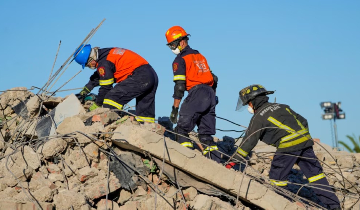 Rescue personnel search the site of a building collapse in George, South Africa, May 9, 2024. Internet