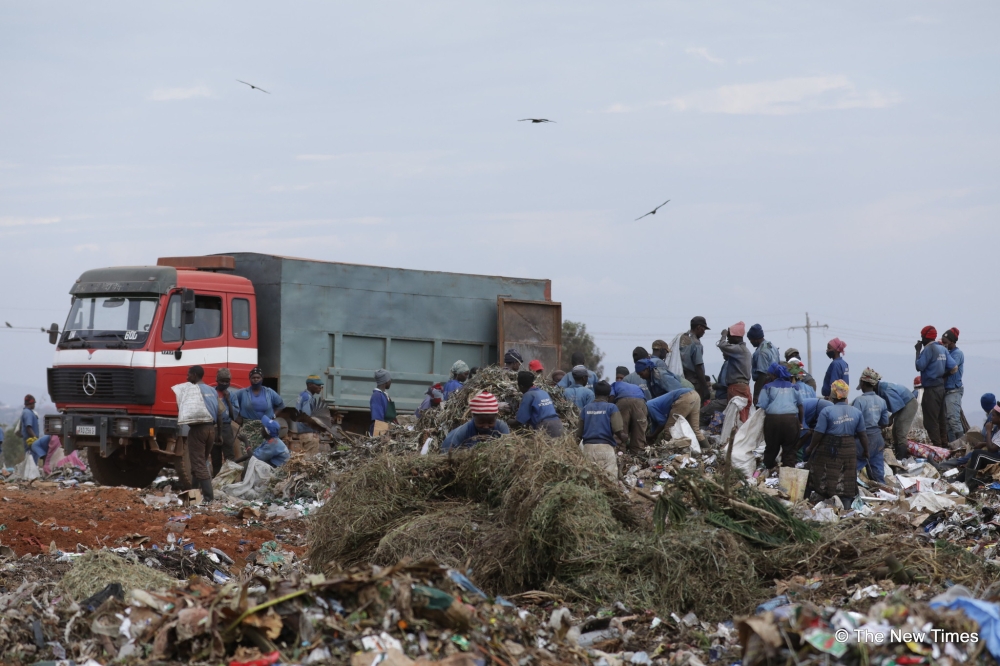 Workers sorting waste at Nduba landfill in Gasabo District. File