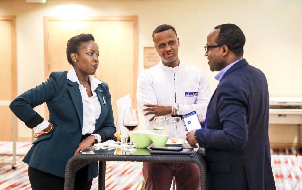 Minister of ICT and Innovation Paula Ingabire interacts with Minister of Education Gaspard Twagirayezu at the event to celebrate the launch of the 2nd phase of the Rwanda Economy Digitalisation programme,o May 10. Photo by Craish Bahizi