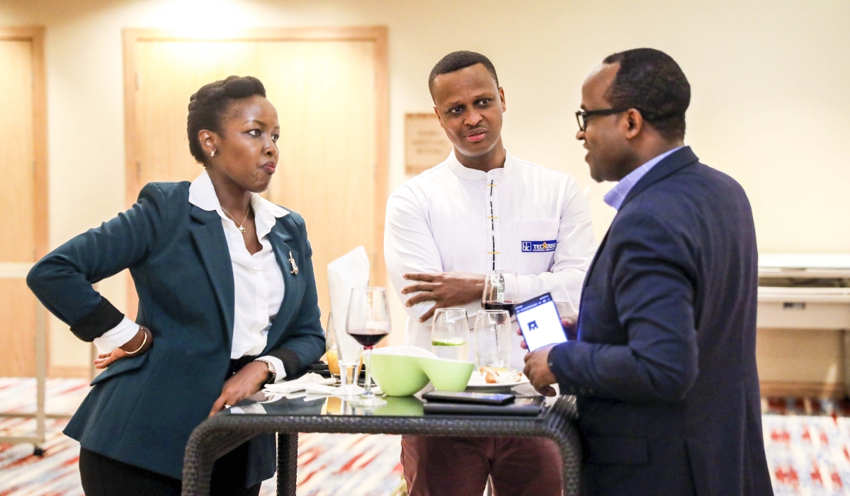 Minister of ICT and Innovation Paula Ingabire interacts with Minister of Education Gaspard Twagirayezu at the event to celebrate the launch of the 2nd phase of the Rwanda Economy Digitalisation programme,o May 10. Photo by Craish Bahizi