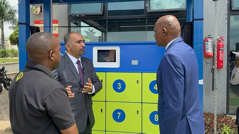 Spiro&#039;s Country Head, Arun Bhandari explains to Deputy Director General of REMA Mr. Faustin Munyazikwiye how motorbike taxi drivers can swap batteries in less than a minute with the new Smart Swapping Stations.