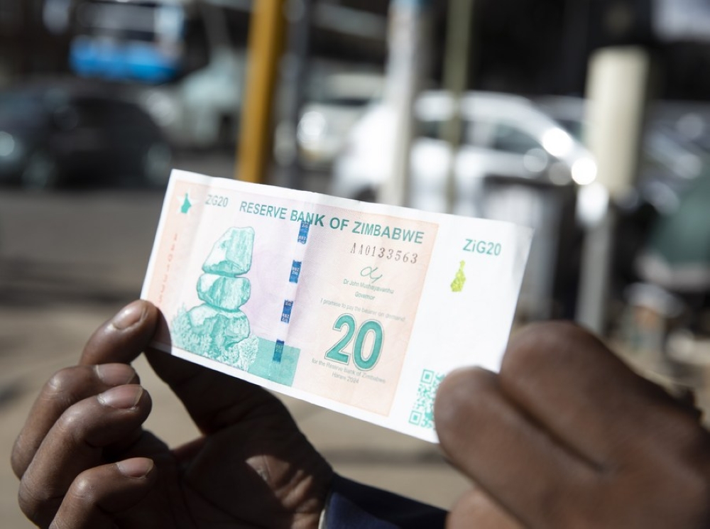 A person shows a new currency Zimbabwe Gold banknote in Harare, Zimbabwe, on May 15, 2024. (Photo by Shaun Jusa/Xinhua)