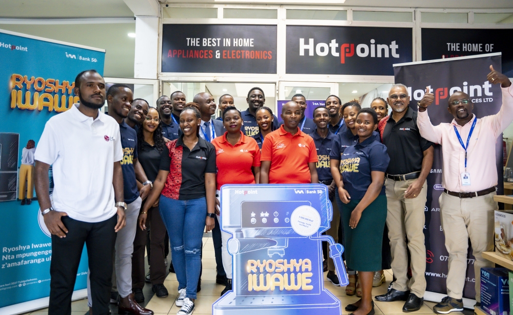 I&M Bank Rwanda officials and HotPoint staff pose for a photo as the bank launched its retail campaign, ‘Ryoshya Iwawe’, on Friday, May 17. Photos by Emmanuel Dushimimana