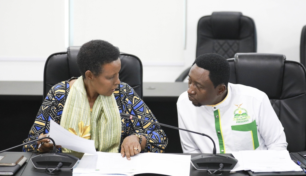 National Electoral Commission (NEC) Chairperson Oda Gasinzigwa interacts with Green Party President Frank Habineza while submitting his party&#039;s candidature in Kigali. Photo by Craish Bahizi
