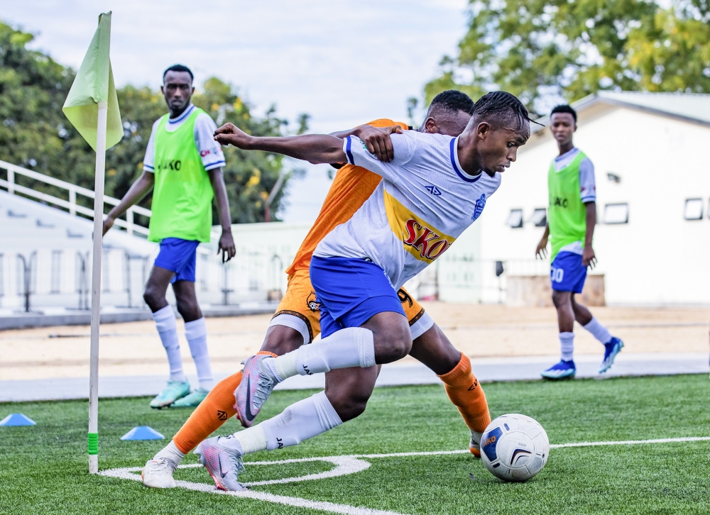 Rayon Sports captain Kevin Muhire wins the ball against Bugesera FC defenders during the Peace Cup at Kigali Pele Stadium. Photo Emmanuel Dushimimana