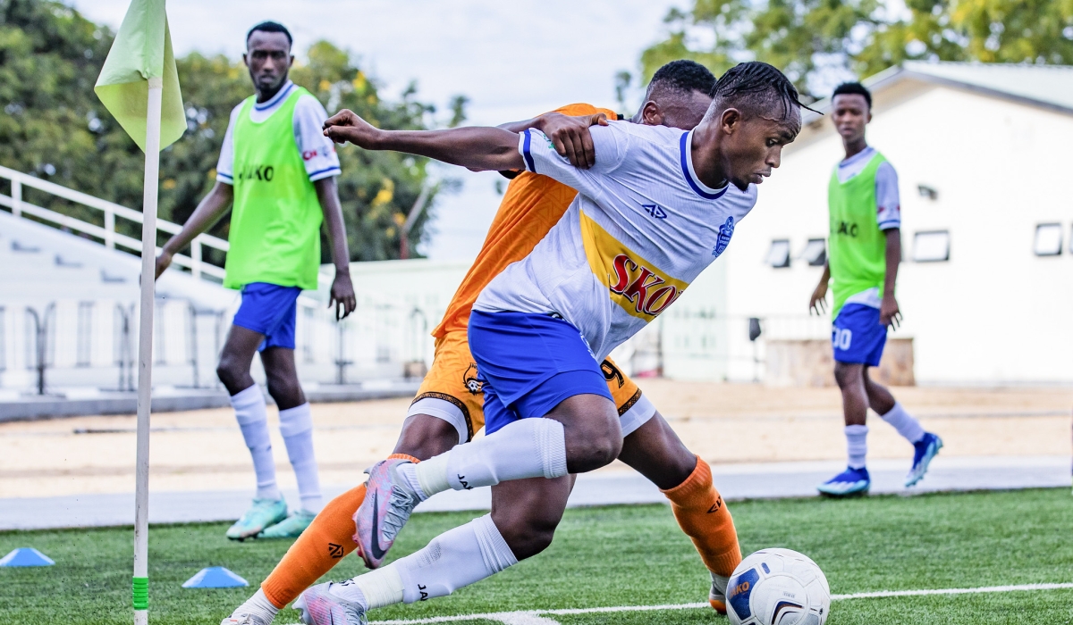Rayon Sports captain Kevin Muhire wins the ball against Bugesera FC defenders during the Peace Cup at Kigali Pele Stadium. Photo Emmanuel Dushimimana