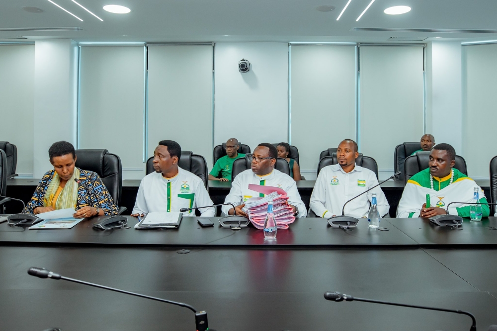 The Chairperson of the National Electoral Commission (NEC), Oda Gasinzigwa (L) receives a list of 65 parliamentary candidates from the Democratic Green Party of Rwanda, represented by its leaders including its chairperson Frank Habineza, and its Secretary-General, Jean Claude Ntezimana, on May 20, 2024, at NEC headquarters in Kigali (courtesy).