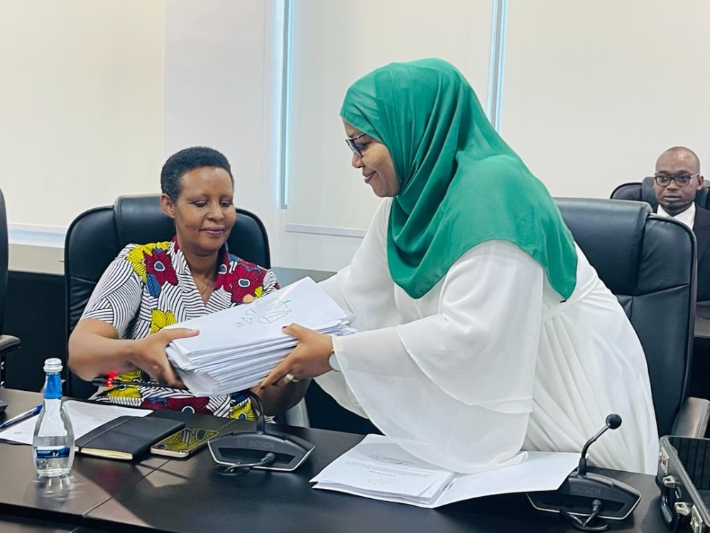 Ideal Democratic Party (PDI)&#039;s Second Vice President  Fatou Harerimana submits a list of 55 candidates to Oda Gasinzigwa, the Chairperson of National Electoral Commission, on May 22. Ntirenganya