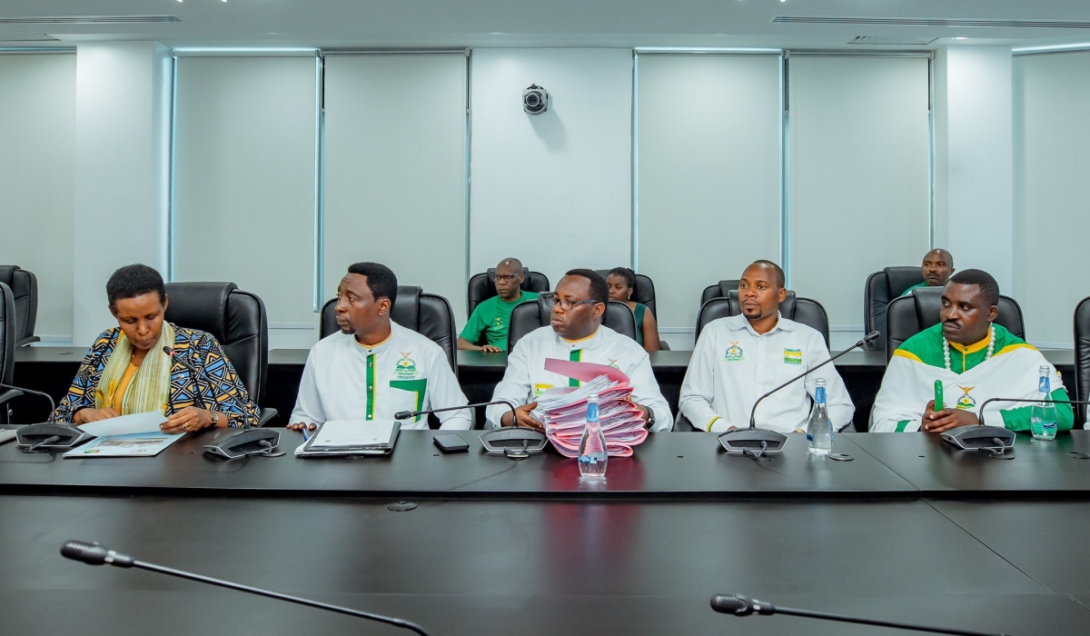 The Chairperson of the National Electoral Commission (NEC), Oda Gasinzigwa (L) receives a list of 65 parliamentary candidates from the Democratic Green Party of Rwanda, represented by its leaders including its chairperson Frank Habineza, and its Secretary-General, Jean Claude Ntezimana, on May 20, 2024, at NEC headquarters in Kigali (courtesy).