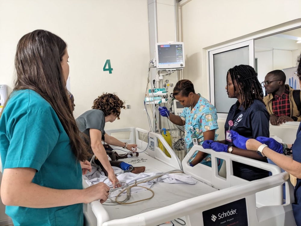 Israeli medics alongside their Rwandan counterparts attend to a young patient who had just undergone a minimally invasive cardiac surgery procedure. Courtesy