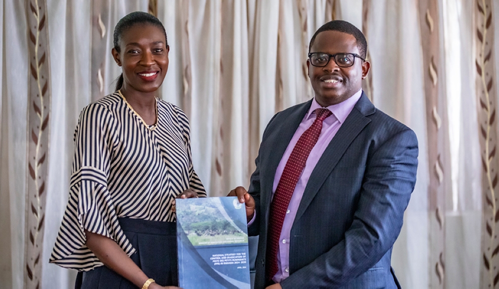 Permanent Secretary, Ministry of Agriculture, and Animal Resources  Olivier Kamana and Coumba Sow, the FAO country Representative during the handover on May 21. Emmanuel Dushimimana
