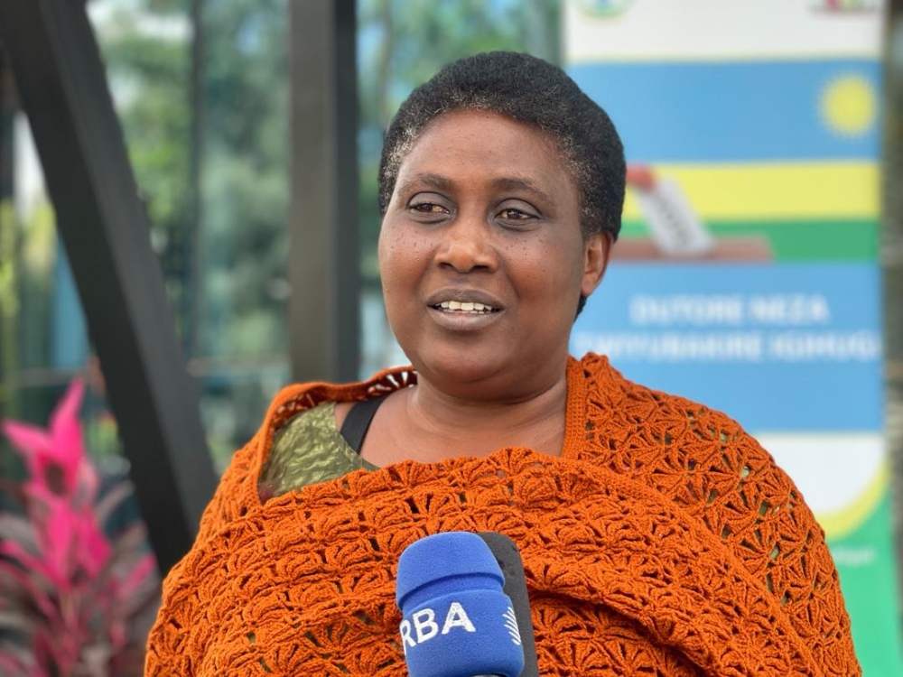 Elisabeth Niyirora, 57, a secondary school teacher at Hanika high school in Nyanza District, speaks to journalists after submitting her candidature on Thursday, May 23. PHOTOS BY EMMANUEL NTIRENGANYA