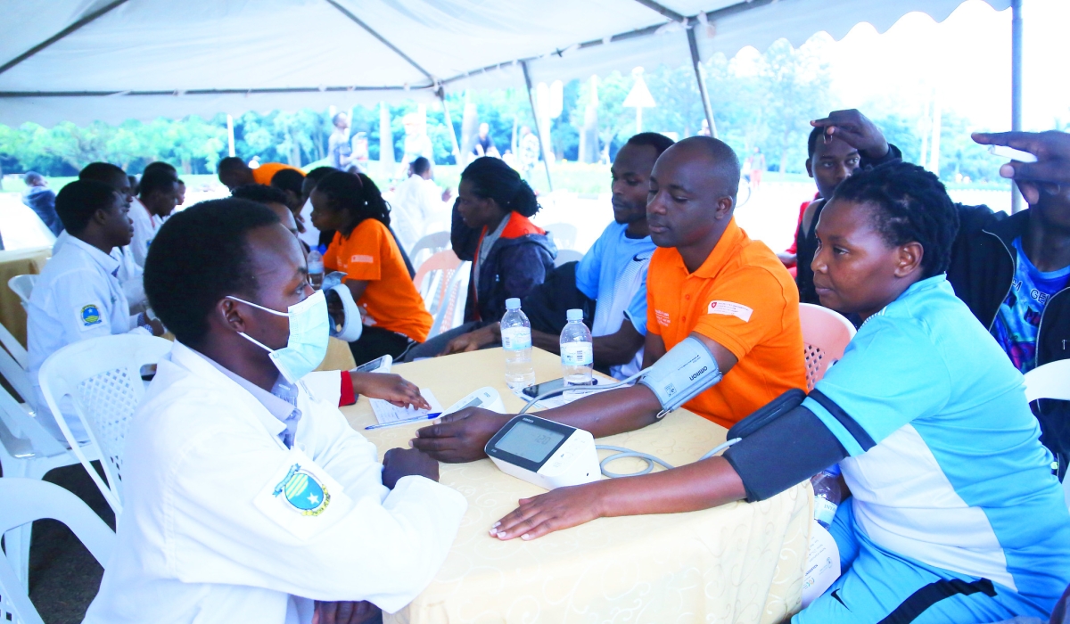 Kigali residents undergo a mass screening exercise of Non-Communicable Diseases during Car Free Day mass sports. Photo by Craish Bahizi