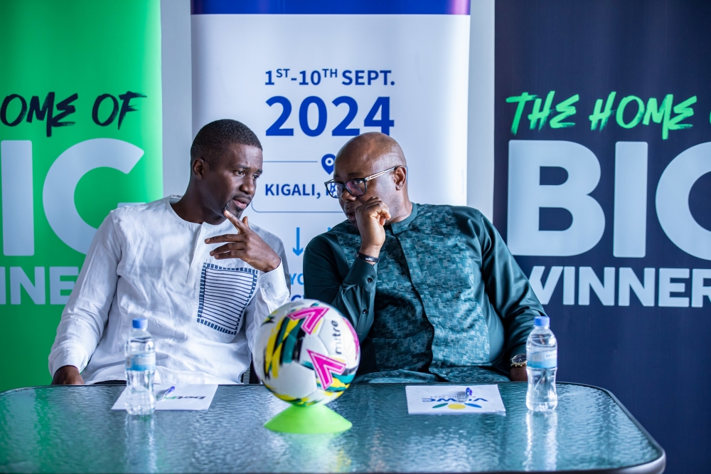 VCWC founder Fred Siewe interacts with Ntoudi Mouyelo, the Chief Commercial Officer of BetPawa Group during the signing ceremony in Kigali on Friday May 24. Photos by Dan Gatsinzi