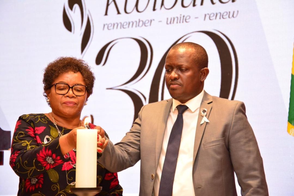 Malawi&#039;s Minister of Foreign Affairs Nancy Tembo and Douglas Gakumba, Chargé d&#039;Affaires of Rwanda&#039;s embassy in Malawi light a flame of hope in honour of victims of the Genocide