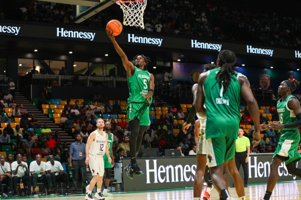 AS Dounes&#039; Jean Jacques Boissy jumps to score during his side&#039;s 63-57 win over Rivers Hoopers in Saturday night&#039;s classification round game at BK Arena-Dan Gatsinzi