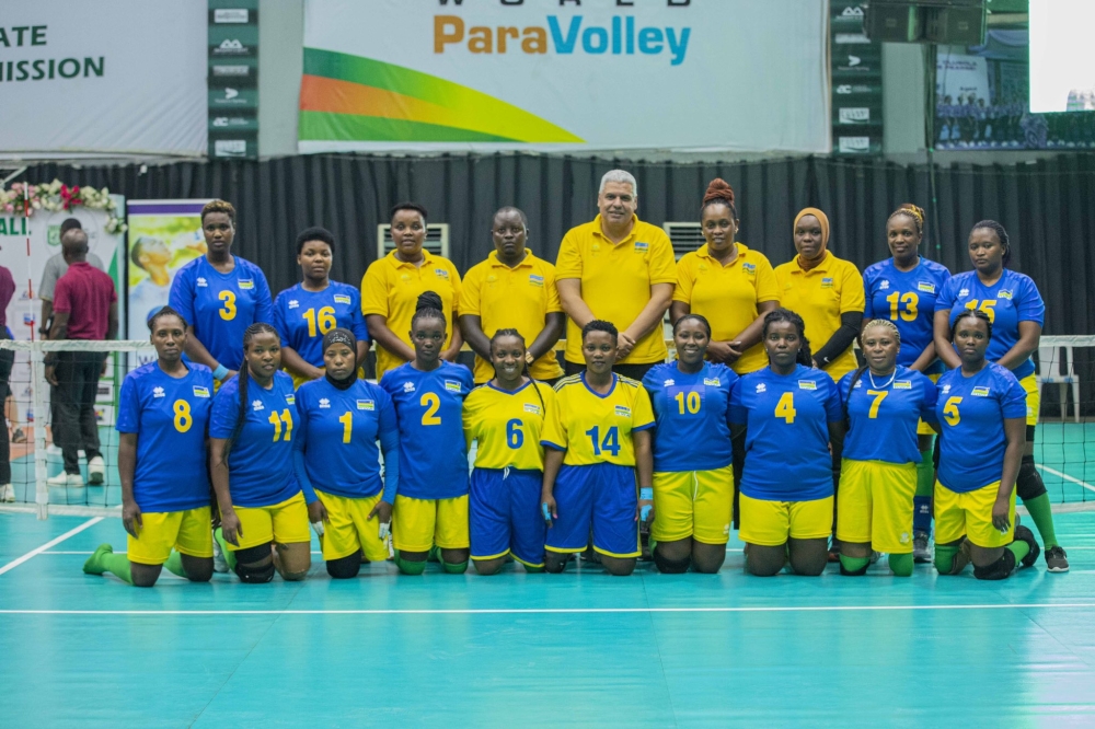 Rwanda women sitting volleyball team head coach Mosaad Rashad Elaiuty and his players pose for a group photo. Courtesy
