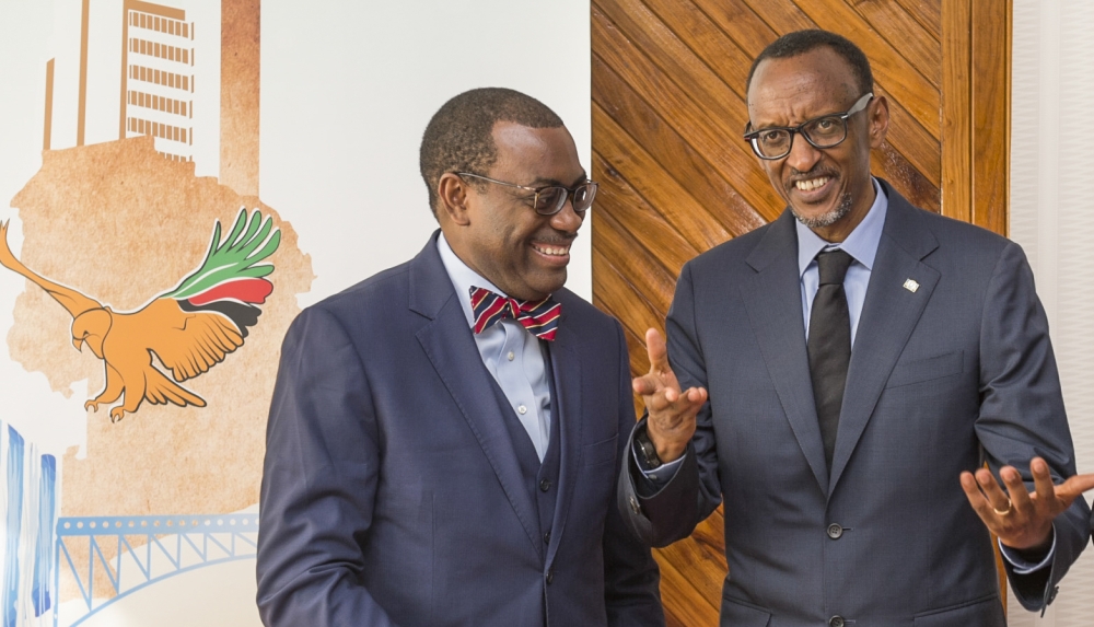 President Paul Kagame interacts with Akinwumi A. Adesina, President of the African Development Bank Group. Kagame is expected to attend the African Development Bank (AfDB) Annual Meeting, slated for May 27 to 31