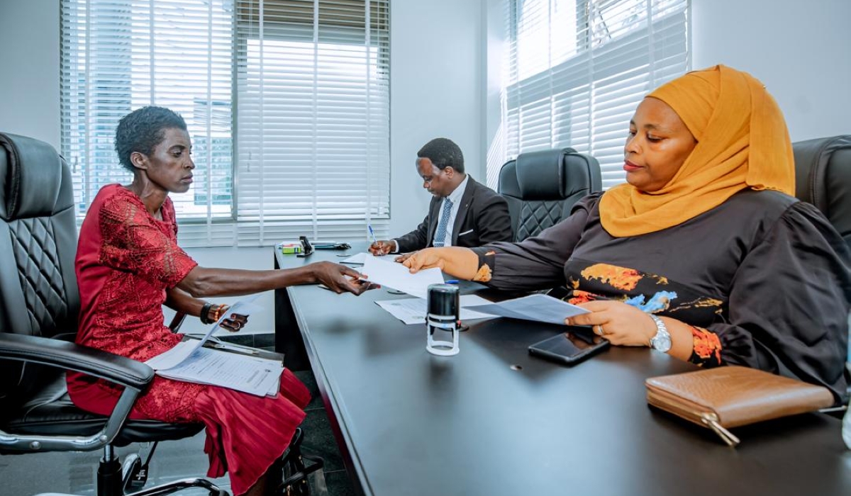 Liberata Kayirama, a primary school teacher submits her candidature to the National Electoral Commission (NEC), on Monday, May 27. Courtesy