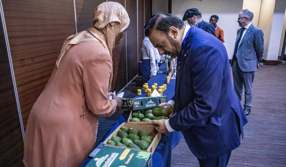 Dr. Nasir Awan, President of the Greater Birmingham Chamber of Commerce, checks out avocados from a local producer on the exhibition stand during the Rwanda-UK Trade Mission in Kigali on Tuesday, May 28. Photos by Emmanuel Dushimimana for The New Times