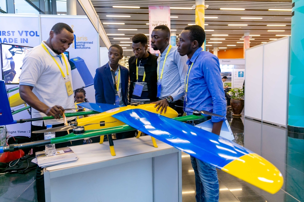 Visitors interact with an exhibitor who was showcasing a Made in Rwanda drone. Rwanda has allocated Rwf2.3 billion in the 2024-2025 fiscal year as initial funding for setting up a Drone Operation Centre. Sam Ngenda